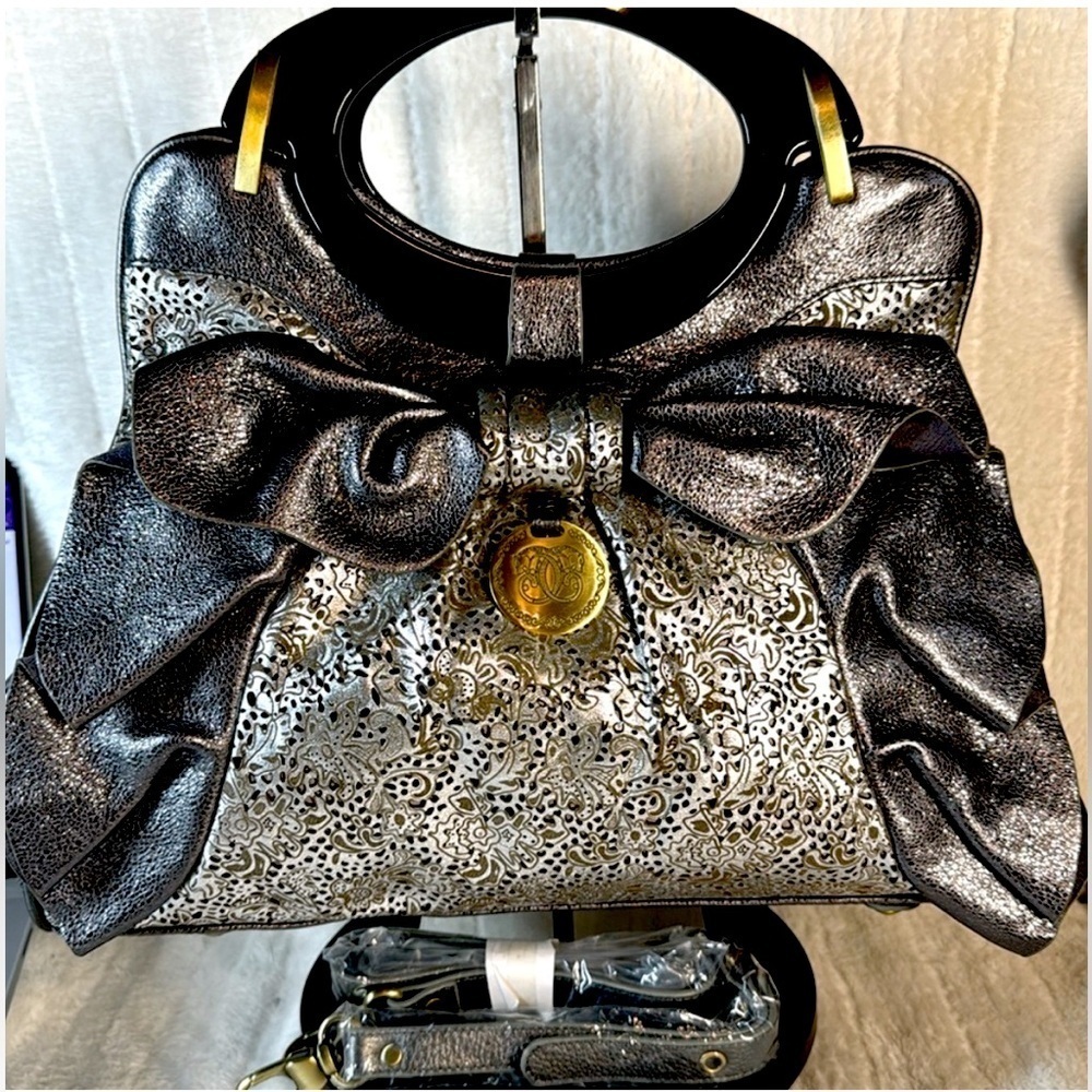Sharif Rare Leather Silver Bow Laser Cut
Satchel NWOT